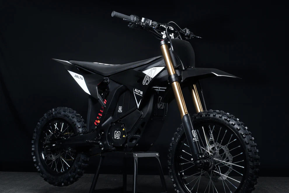 Black Delta dirt bike on a dark background