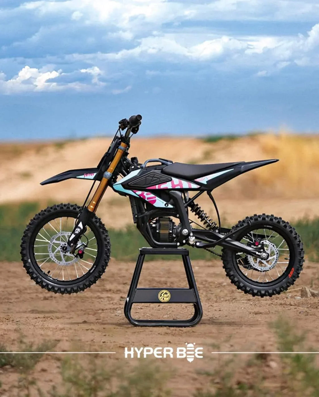 Small dirt bike on a stand with a clear sky background, featuring the brand 'Hyper Bee'.