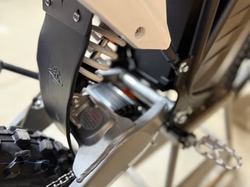 Close-up of a bicycle chain mechanism with a blurred background