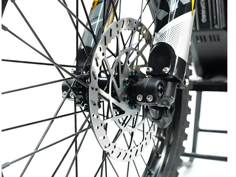 Close-up of a bicycle wheel with disc brake system on a white background