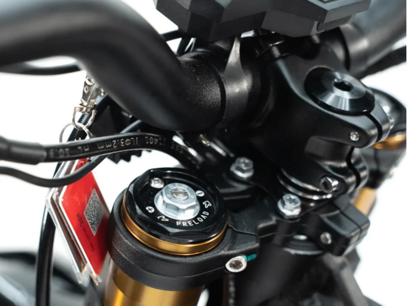 Close-up of a motorcycle's handlebar and control mechanisms