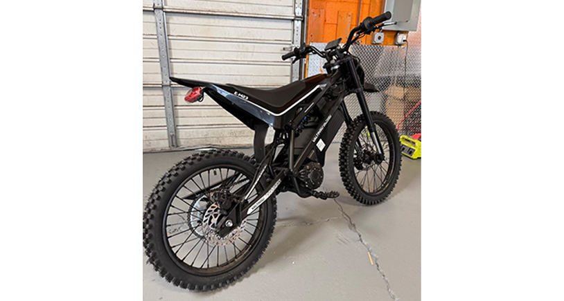 Black electric bike in a garage setting