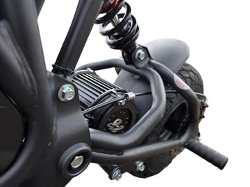 Close-up of a motorcycle's suspension system on a white background