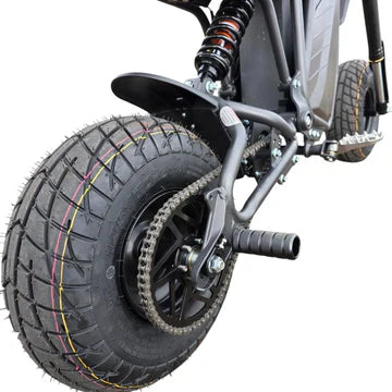 Close-up of a scooter wheel with suspension system on a white background