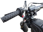 Close-up of motorcycle handlebar with black grips and visible brand logo.