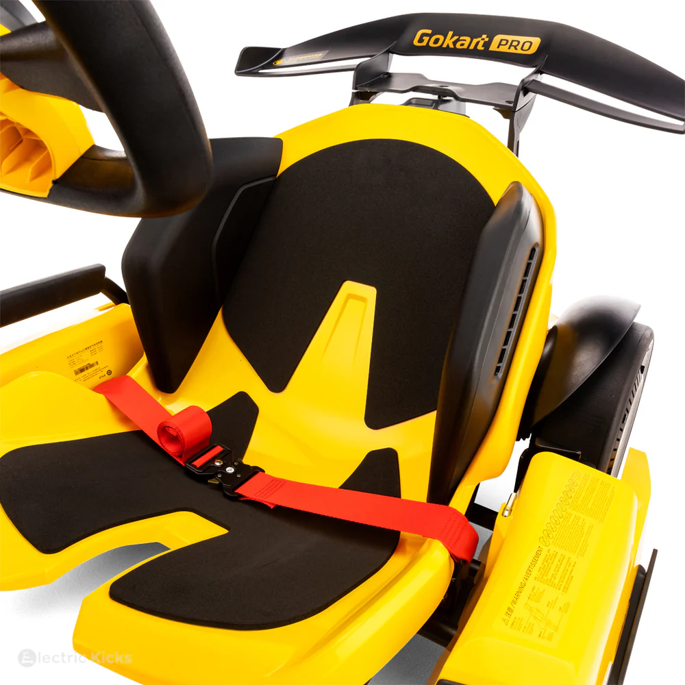 Yellow and black Gokart Pro seat with red strap on a white background
