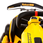 Close-up of a yellow and black go-kart with 'Lamborghini' branding on a white background.