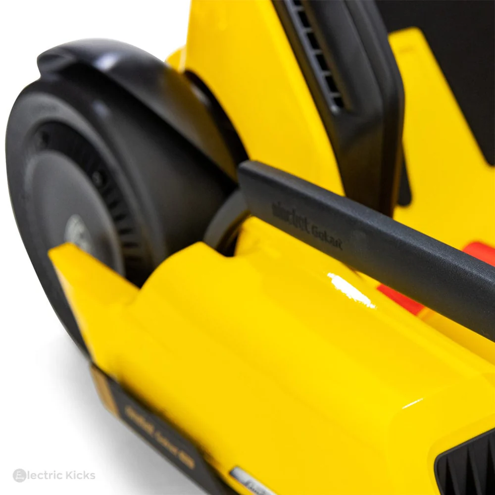 Close-up of a yellow electric scooter with black handlebar on a white background