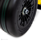 Close-up of a black scooter wheel with visible branding on a white background